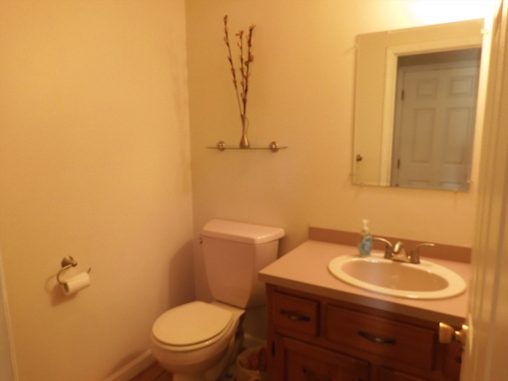 115 Merrimack Road, Unit 115 Methuen, MA 01844 - Photo 4 of 23 a bathroom with a sink a toilet and shower
