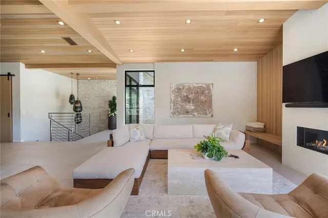 a view of a patio with table and chairs and potted plants