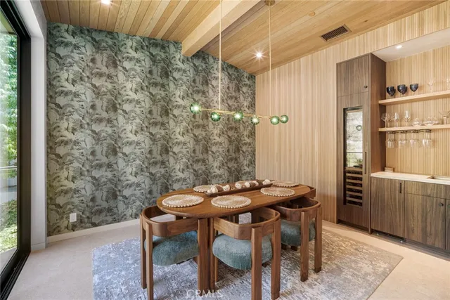 a balcony with table and chairs