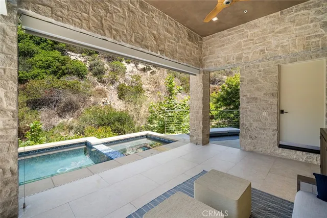 a aerial view of a house with a yard and a fountain