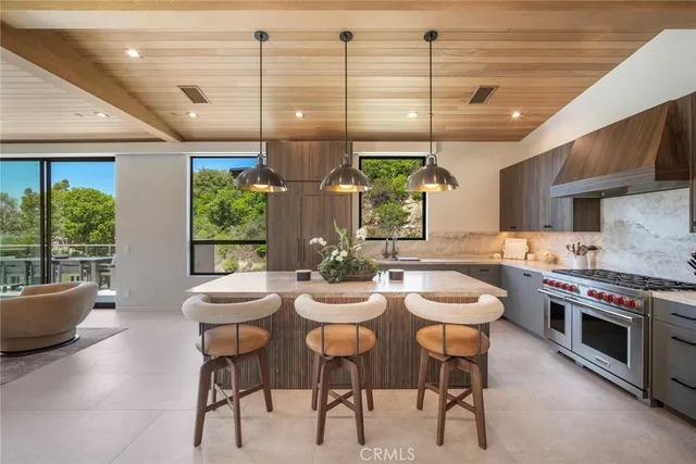 a kitchen with a table and chairs