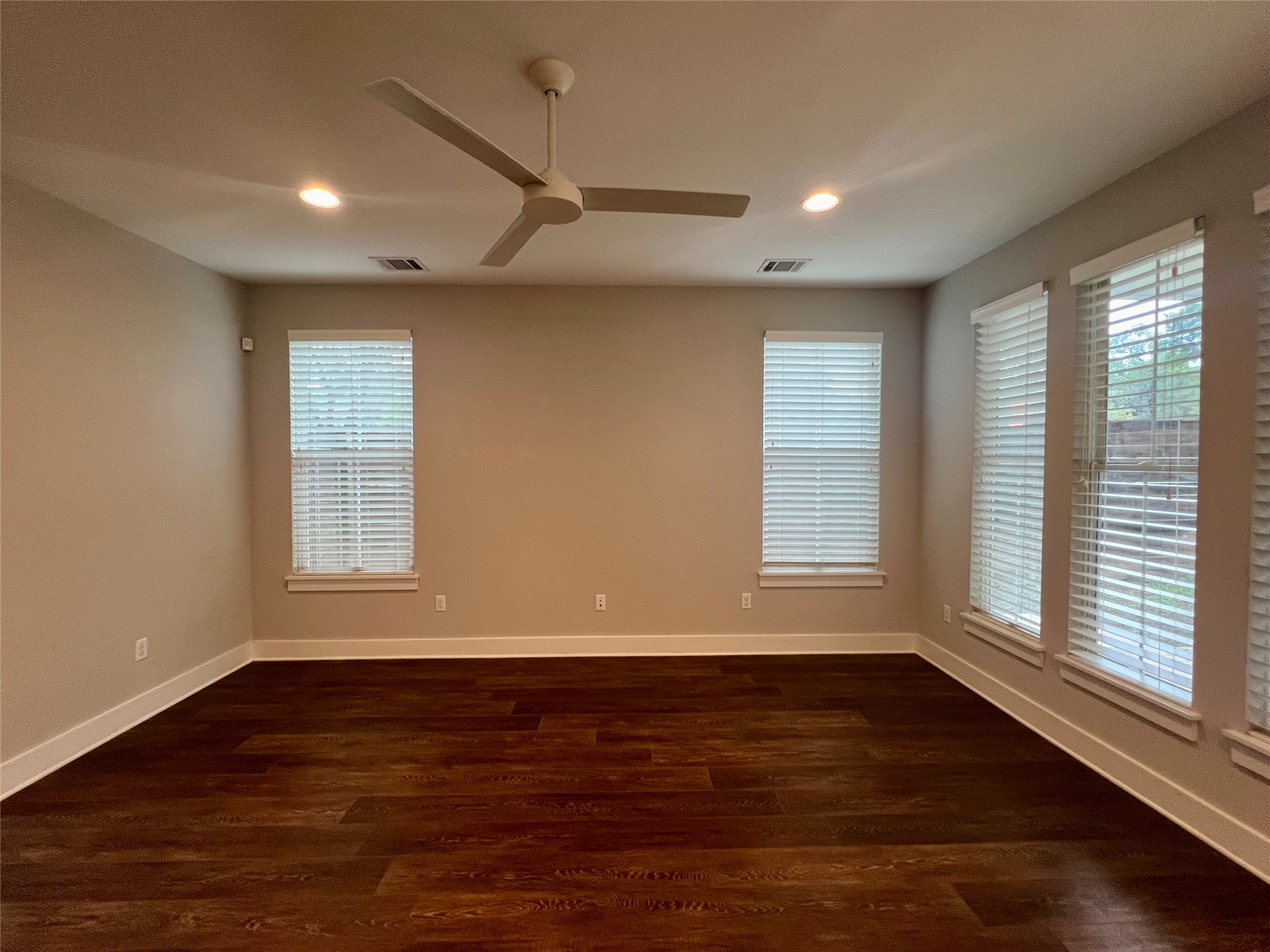 6515 Davis Lane, Unit 10 Austin, TX 78749 - Photo 3 of 22 Rich hardwood floors create a welcoming atmosphere in this spacious living area.
