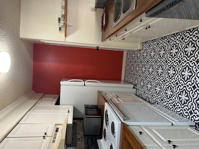 a kitchen with a sink a stove and refrigerator