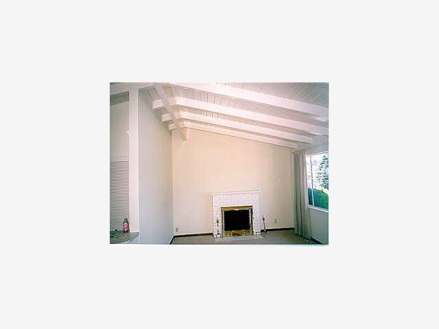 810 Rosita Road Del Rey Oaks, CA 93940 - Photo 4 of 9 a living room with a chair and a fireplace