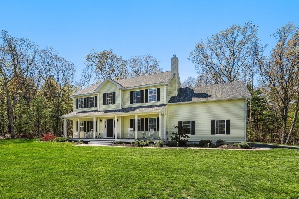 2 Budnick Way Boxford, MA 01921 - Photo 1 of 41 a front view of a house with a garden