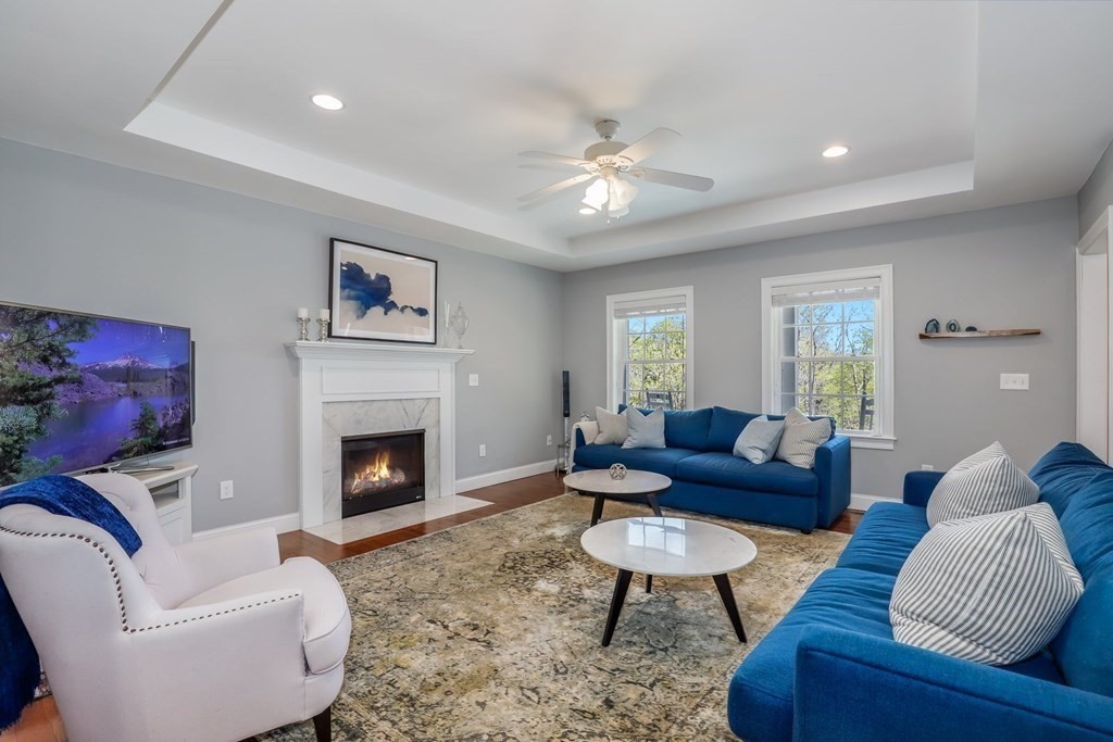 2 Budnick Way Boxford, MA 01921 - Photo 12 of 41 a living room with furniture and a fireplace