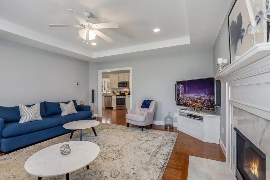 2 Budnick Way Boxford, MA 01921 - Photo 14 of 41 a living room with furniture and a fireplace