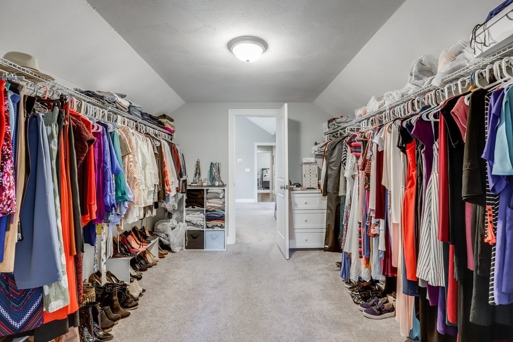 2 Budnick Way Boxford, MA 01921 - Photo 17 of 41 a view of walk in closet with clothes