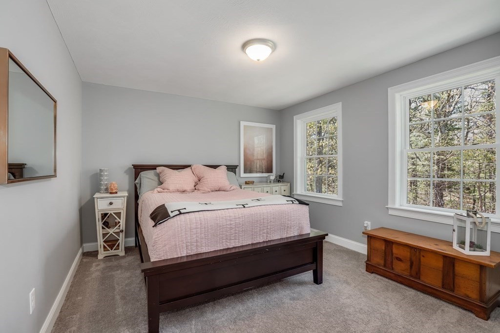 2 Budnick Way Boxford, MA 01921 - Photo 24 of 41 a spacious bedroom with a bed and a couch