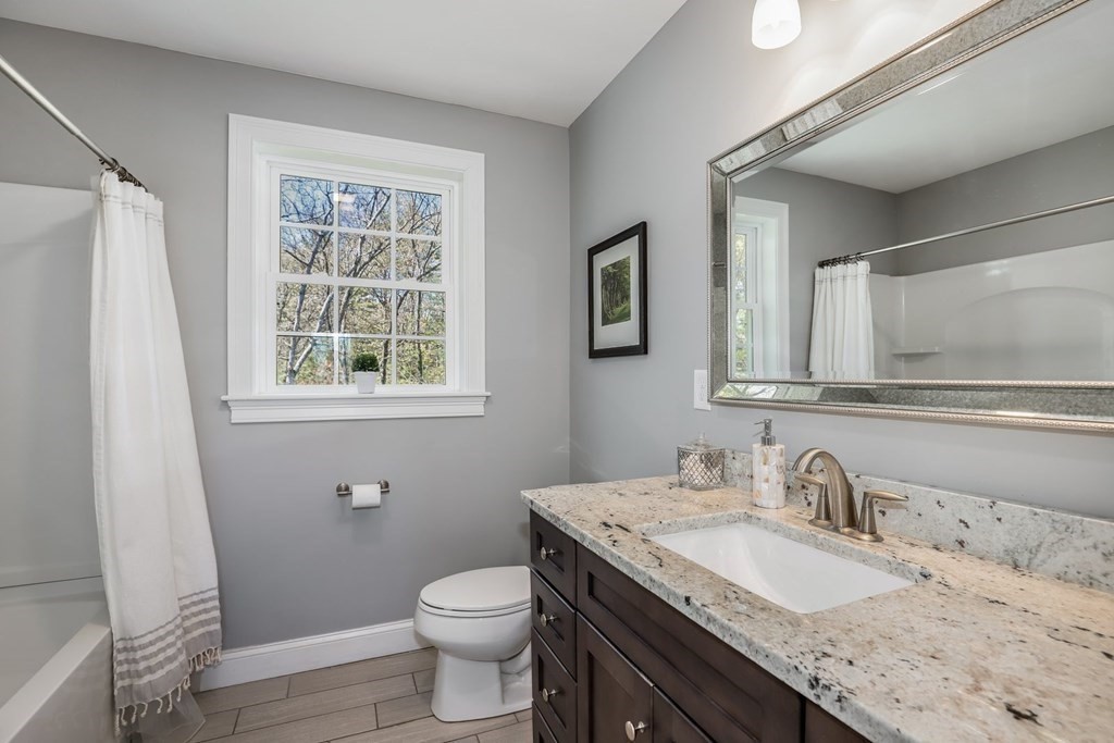 2 Budnick Way Boxford, MA 01921 - Photo 26 of 41 a bathroom with a granite countertop sink toilet and mirror