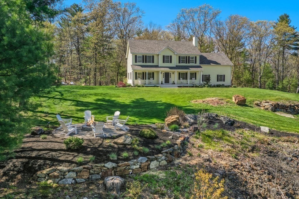 2 Budnick Way Boxford, MA 01921 - Photo 3 of 41 a front view of house with yard and green space