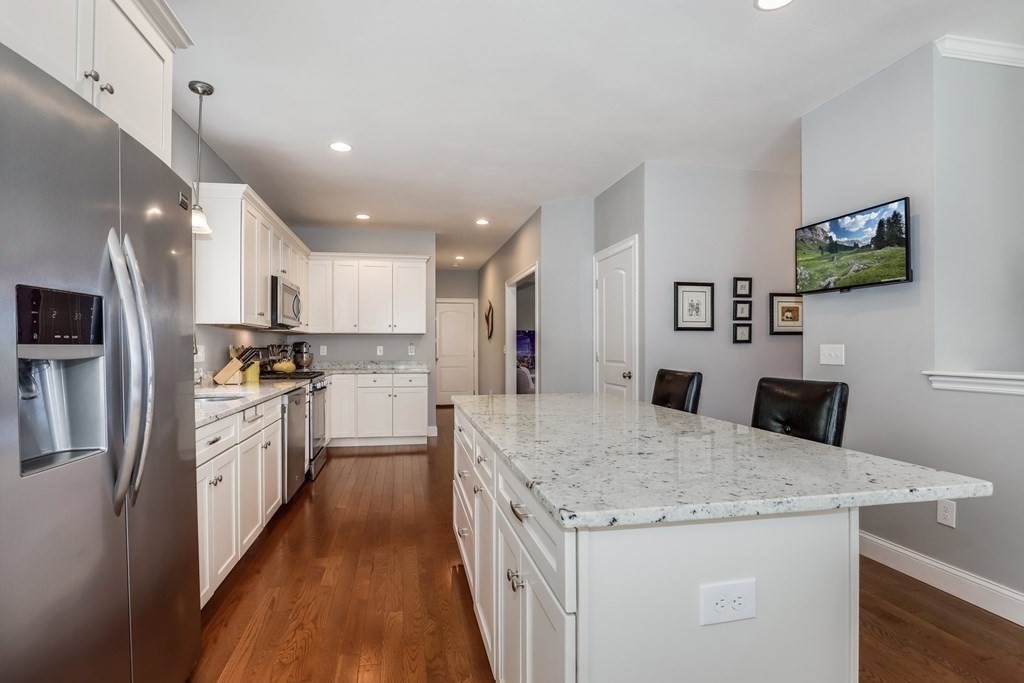 2 Budnick Way Boxford, MA 01921 - Photo 10 of 41 a kitchen with granite countertop a refrigerator and a stove top oven