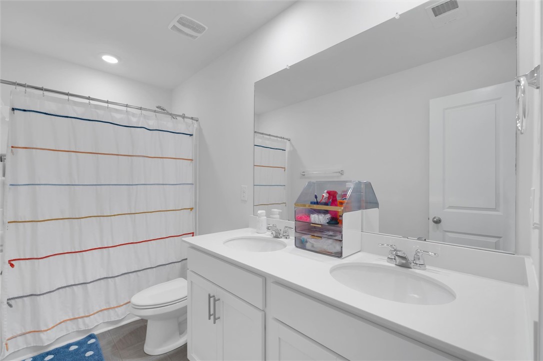 34 Karkinnen Court Pendleton, SC 29670 - Photo 22 of 36 Dual vanity sinks and a clean, spacious countertop define this well-appointed bathroom.