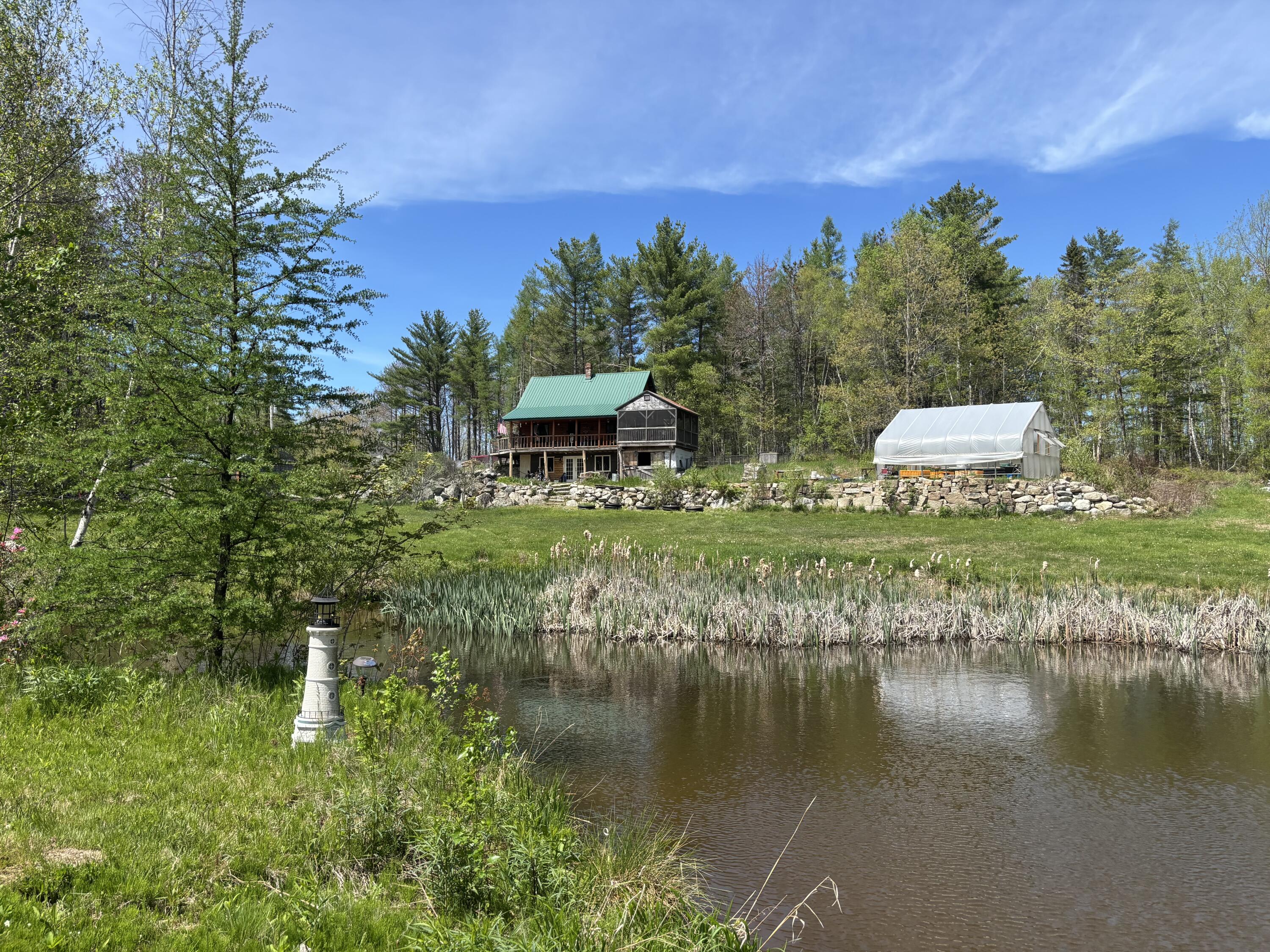 773 Hatchery Road Deblois, ME 04622 - Photo 2 of 24 Pond Looking at Home & Greenhouse