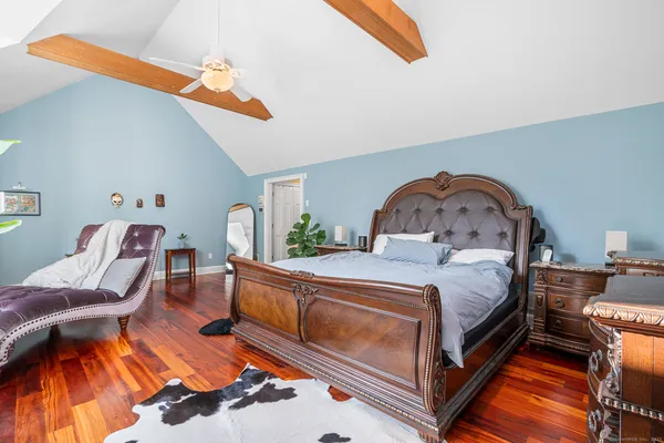 a bedroom with a bed and a dresser