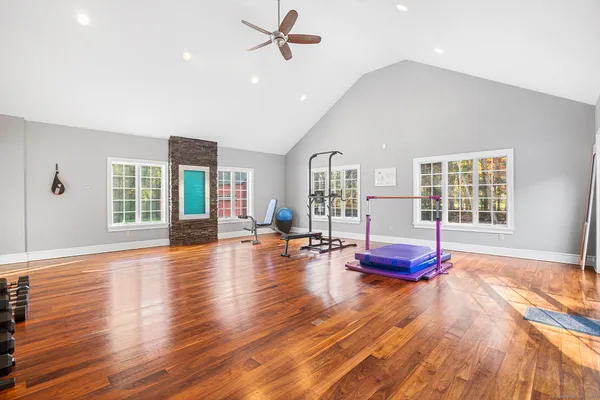 a living room with furniture and wooden floor