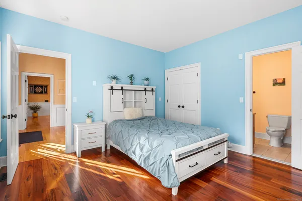 a bedroom with a bed and a table in it