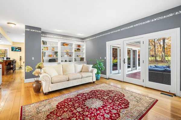 a living room with furniture and a rug