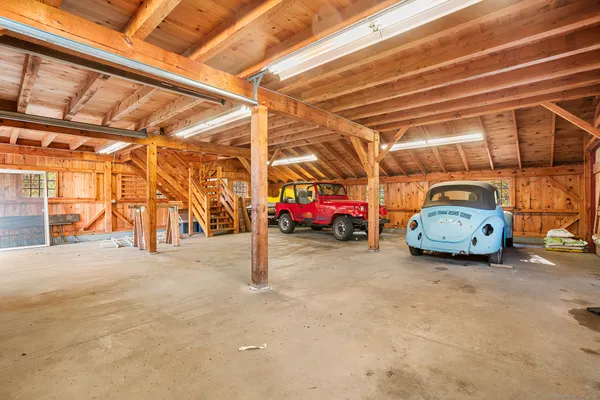 a view of a garage with parked cars