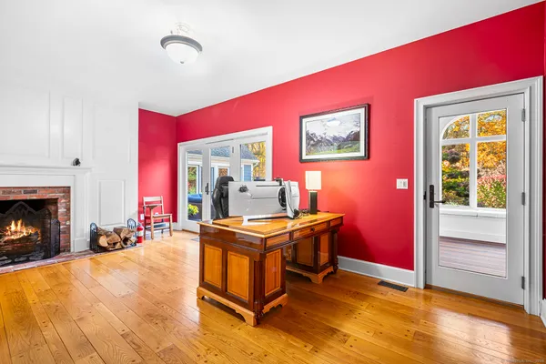 a room with furniture pool table table and a fireplace