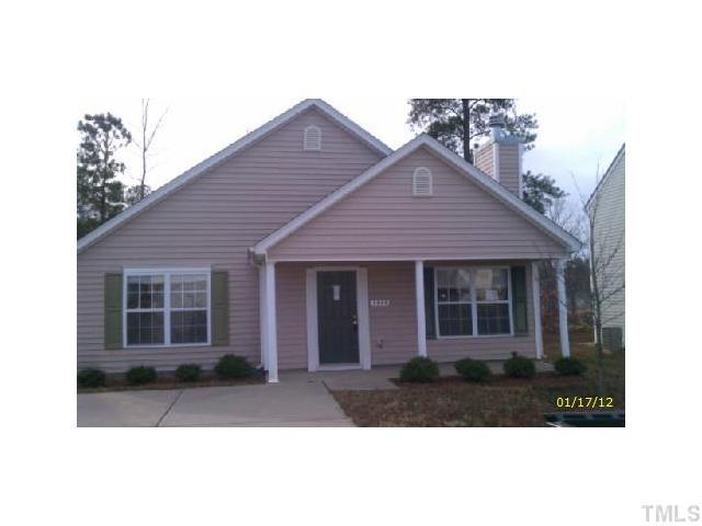 1444 Ricochet Drive Raleigh, NC 27610 - Photo 1 of 8 a front view of a house with a yard