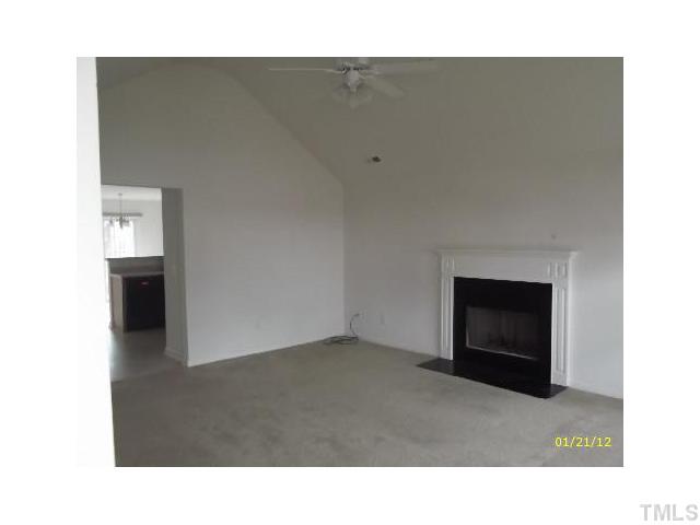 1444 Ricochet Drive Raleigh, NC 27610 - Photo 2 of 8 a open hall with a fireplace
