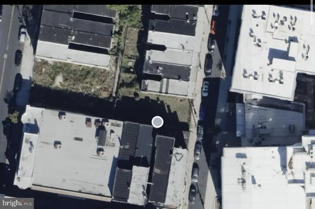 an aerial view of residential house with outdoor space and parking