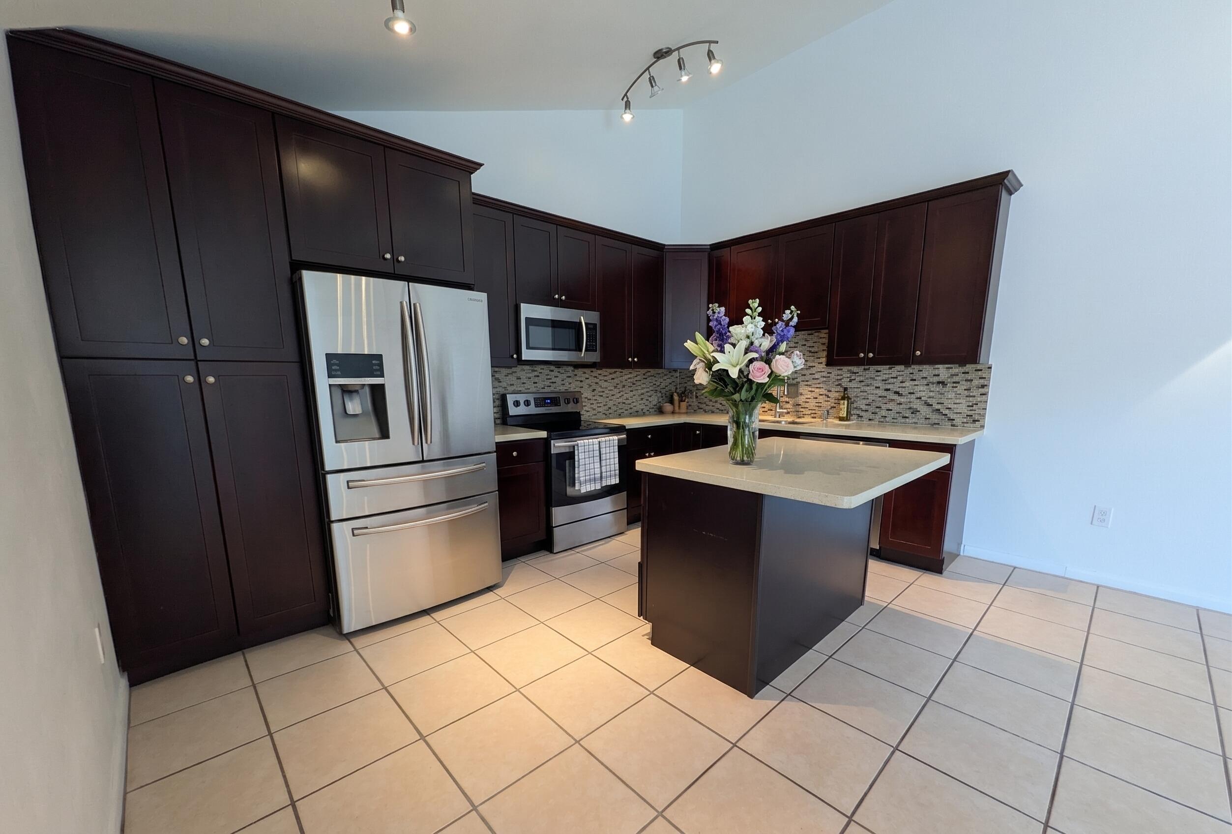 9975 Boca Gardens Trail, Unit A Boca Raton, FL 33496 - Photo 4 of 21 Staged kitchen