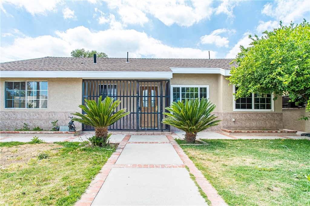 6839 Tampa Avenue Reseda, CA 91335 - Photo 1 of 48 a view of a house with a yard and potted plants