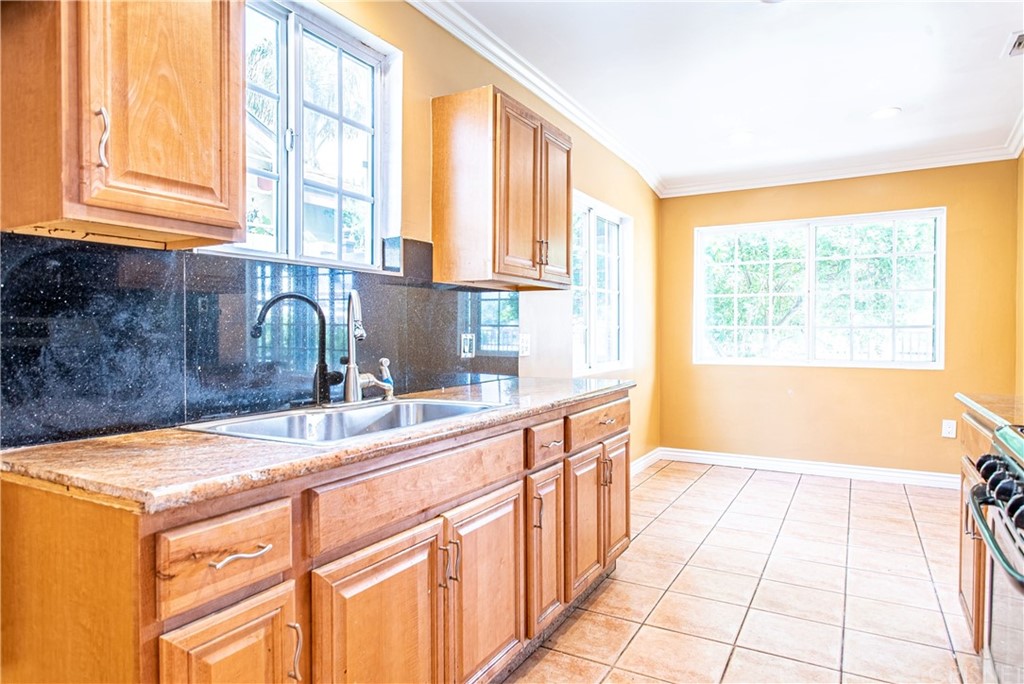 6839 Tampa Avenue Reseda, CA 91335 - Photo 15 of 48 a kitchen with a sink and a window