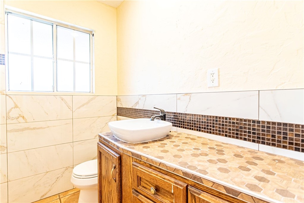 6839 Tampa Avenue Reseda, CA 91335 - Photo 22 of 48 a bathroom with a sink and a toilet