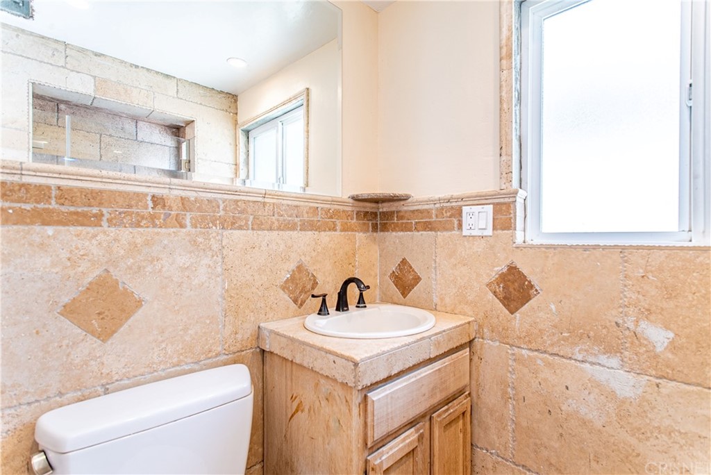 6839 Tampa Avenue Reseda, CA 91335 - Photo 40 of 48 a bathroom with a sink and a toilet