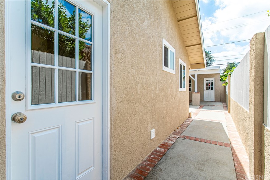 6839 Tampa Avenue Reseda, CA 91335 - Photo 42 of 48 a view of a brick house with a large window