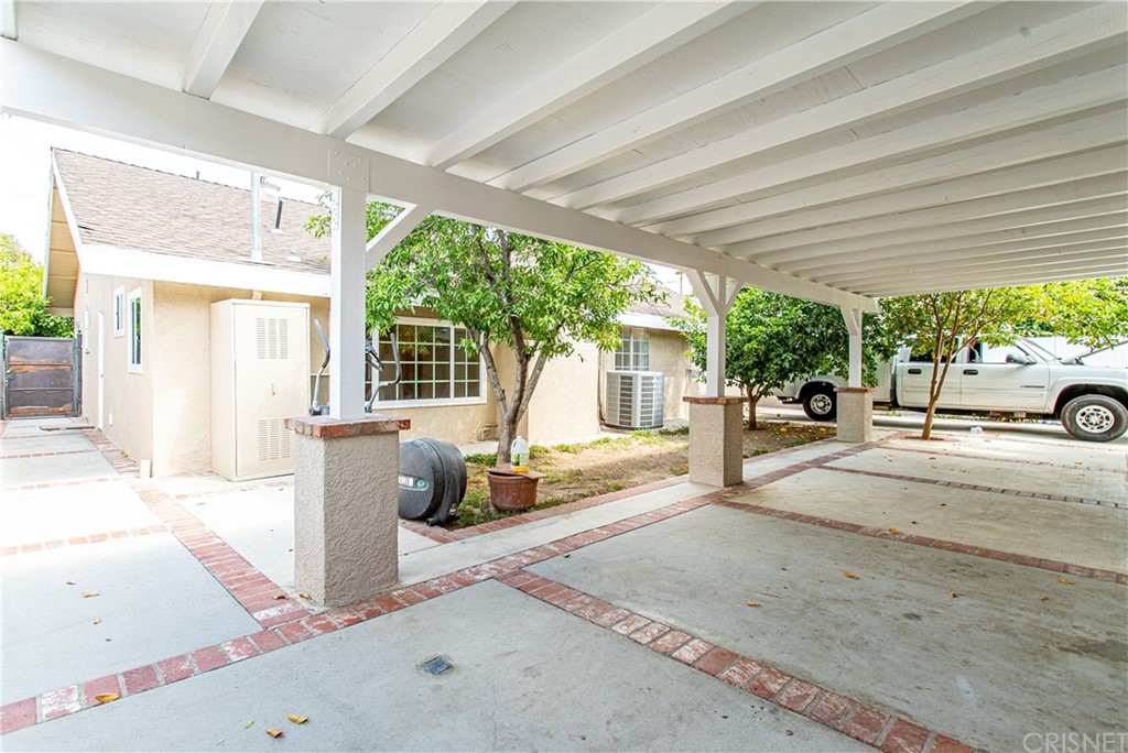 6839 Tampa Avenue Reseda, CA 91335 - Photo 44 of 48 a building exterior with furniture