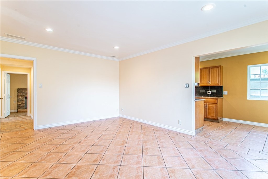 6839 Tampa Avenue Reseda, CA 91335 - Photo 5 of 48 a view of an empty room with wooden floor and a window