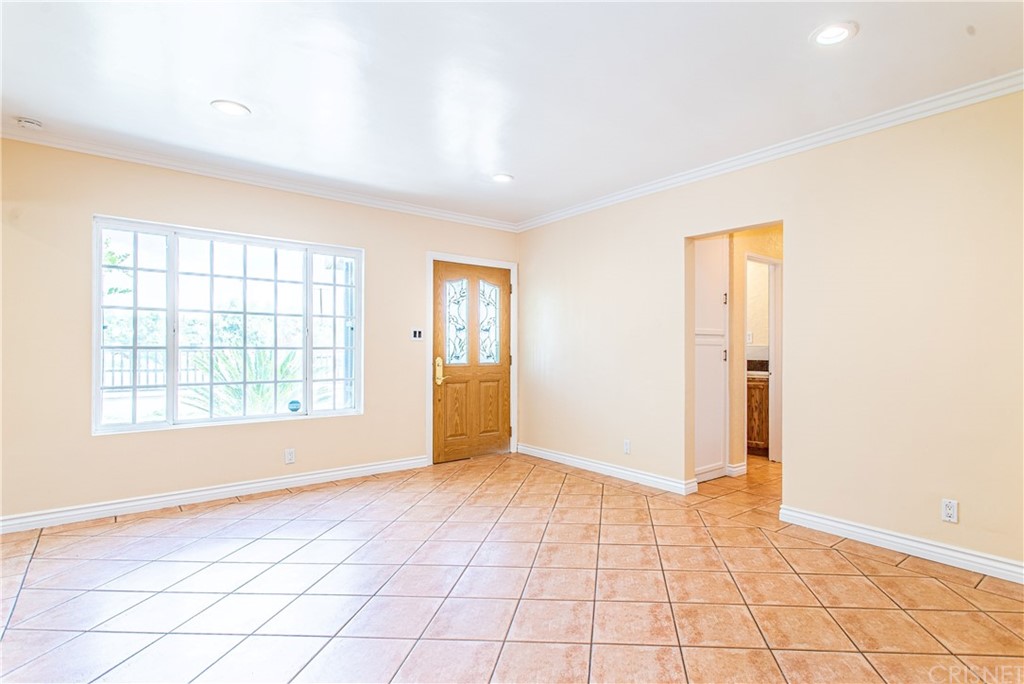 6839 Tampa Avenue Reseda, CA 91335 - Photo 7 of 48 wooden floor in an empty room with a window