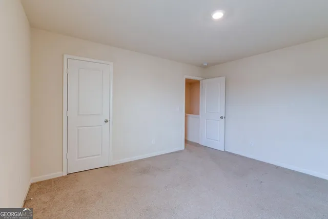 a view of an empty room and entryway