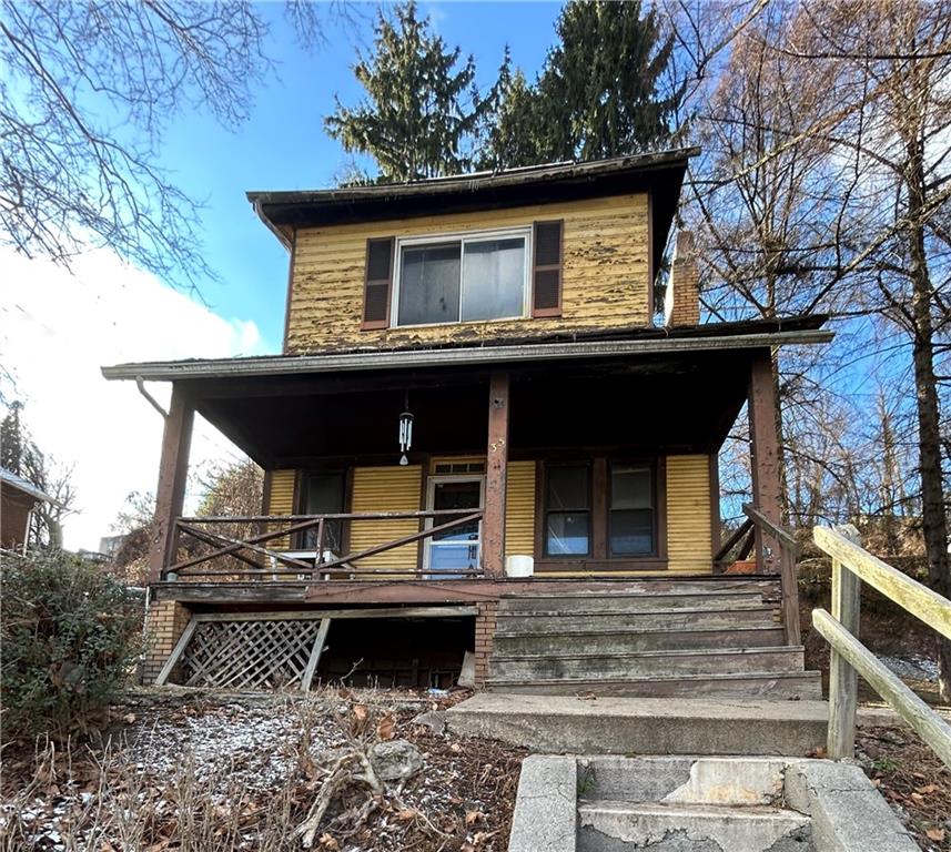 a front view of a house with garage