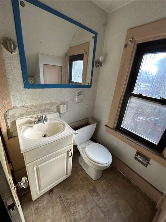 35 Verona Road Pittsburgh, PA 15235 - Photo 15 of 18 a bathroom with a toilet sink and mirror