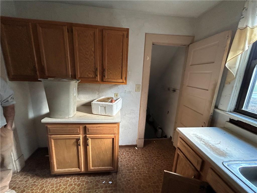 35 Verona Road Pittsburgh, PA 15235 - Photo 9 of 18 a kitchen with wooden cabinets and a stove top oven
