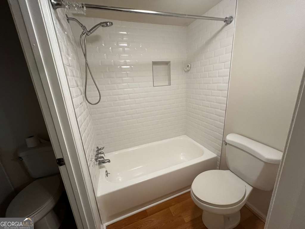 885 Patterns Drive Mableton, GA 30126 - Photo 18 of 22 a bathroom with a tub and a shower