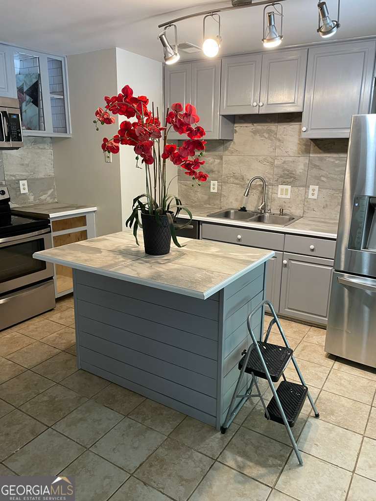 885 Patterns Drive Mableton, GA 30126 - Photo 2 of 22 a kitchen with a sink refrigerator and cabinets