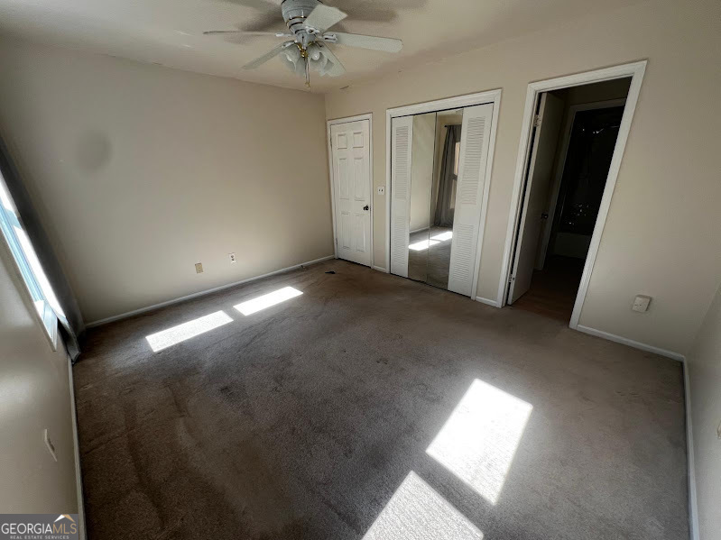 885 Patterns Drive Mableton, GA 30126 - Photo 9 of 22 en empty room with windows and entrance