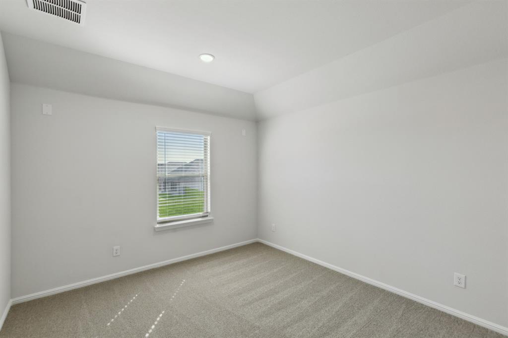 7636 Kingfisher Road Aubrey, TX 76227 - Photo 25 of 34 an empty room with a window