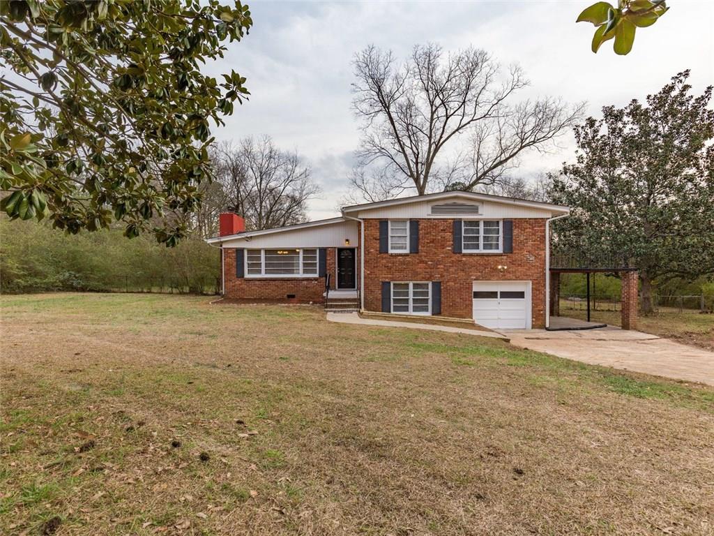 4011 Boring Road Decatur, GA 30034 - Photo 1 of 1 a front view of a house with a garden