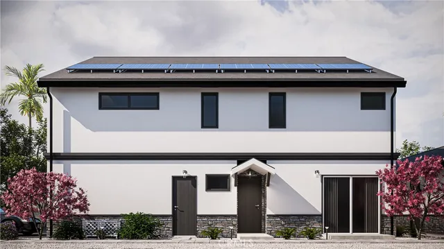 a view of a house with a balcony and plants