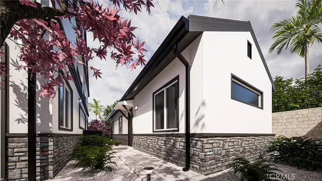 a front view of a house with a tree