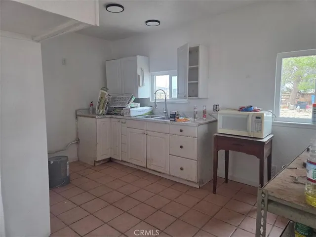 a view of hallway with wooden floor