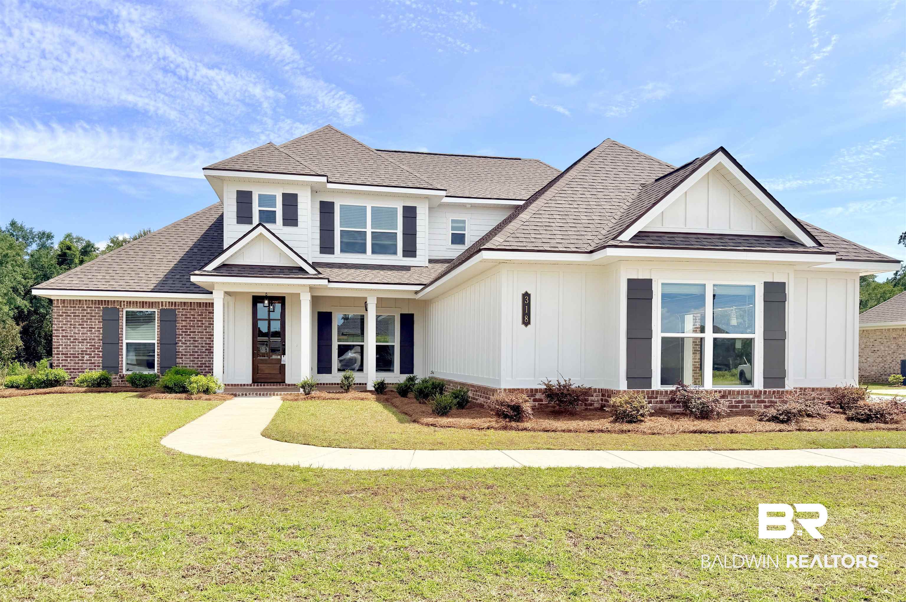 318 Morning Mist Way Fairhope, AL 36532 - Photo 1 of 20 Two-story residence featuring a combination of brick and vertical white siding