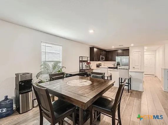 a view of a dining room with furniture